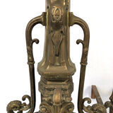 Lot of a pair of chenets and front of gilded bronze fireplace, nineteenth