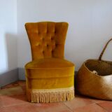 Toad in yellow velvet armchair