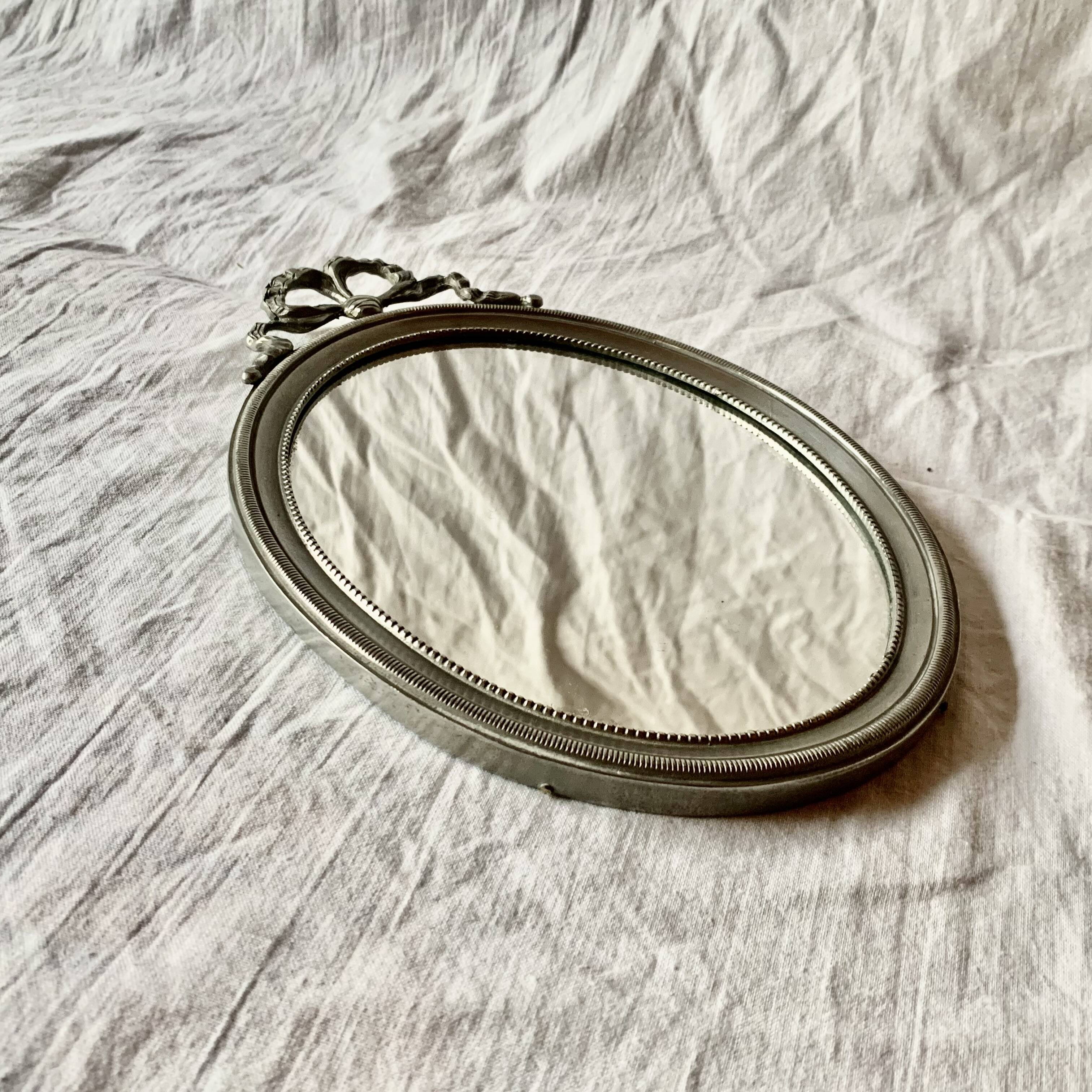 Louis XVI style oval metal wall mirror