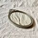 Louis XVI style oval metal wall mirror