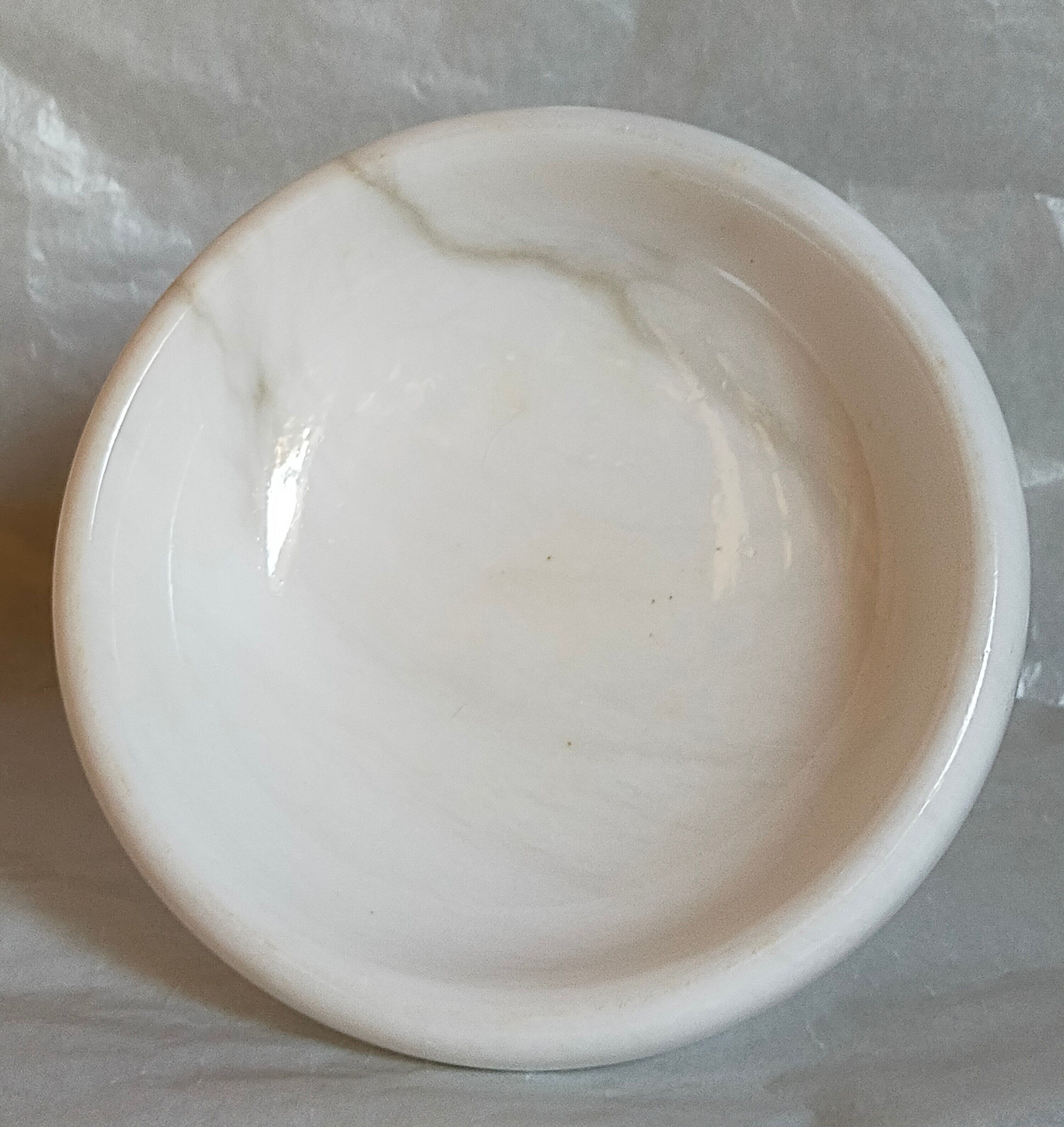 Standing cup in old white marble