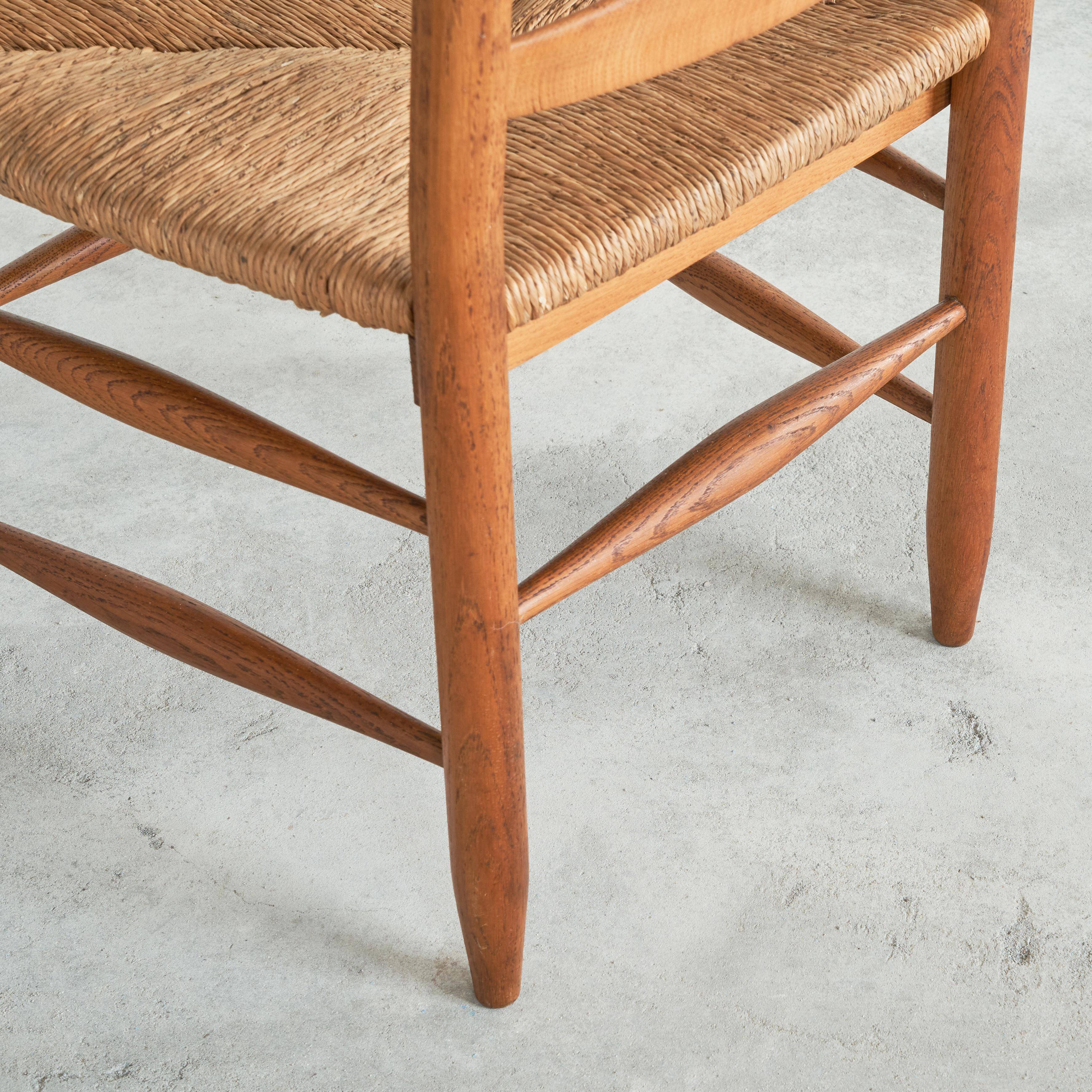 Set of 2 oak and wicker armchairs, mid-20th century.