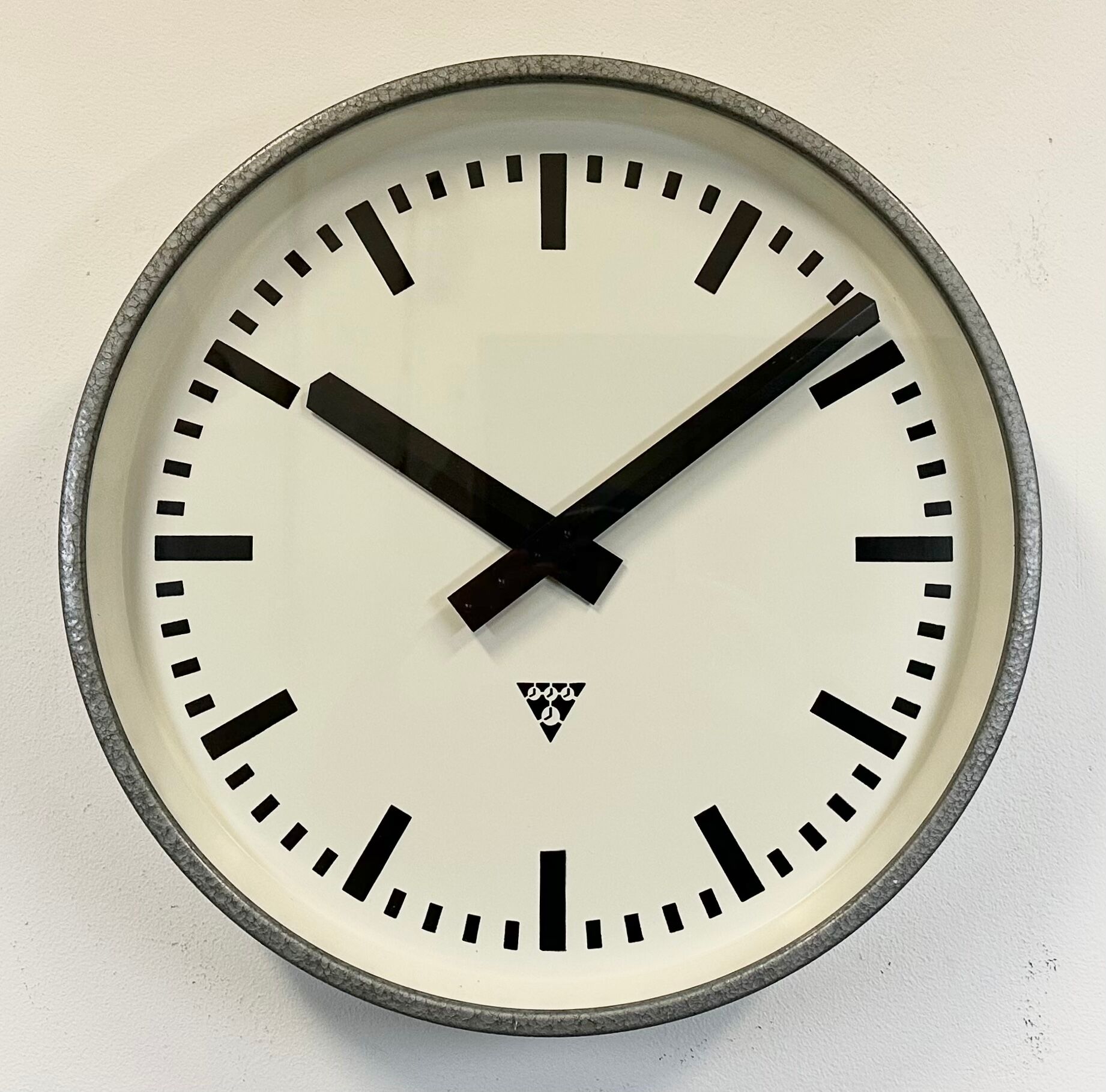 Grey industrial factory wall clock from pragotron, 1960s