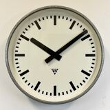 Grey industrial factory wall clock from pragotron, 1960s