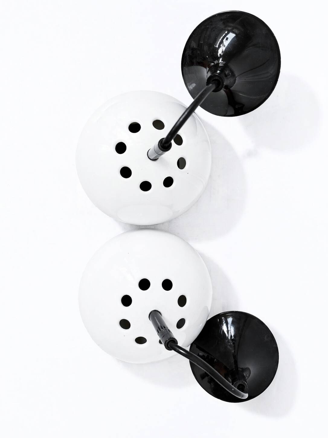 Two white metal globe pendant lights, 1970s.