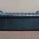 Chesterfield sofa buttoned in blue cowhide, 2.5 seats