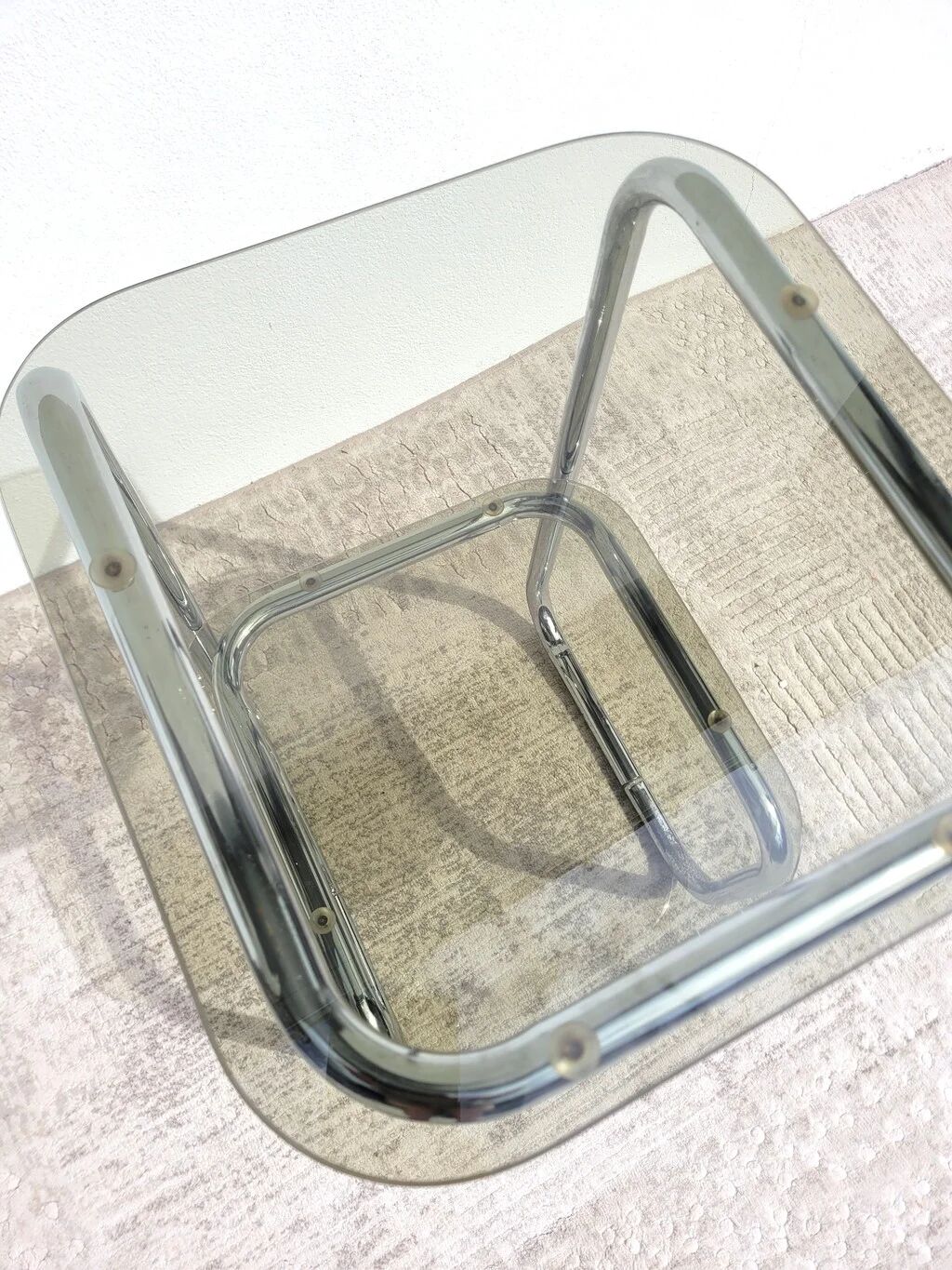 Vintage 1970s side table in chrome metal and smoked glass.