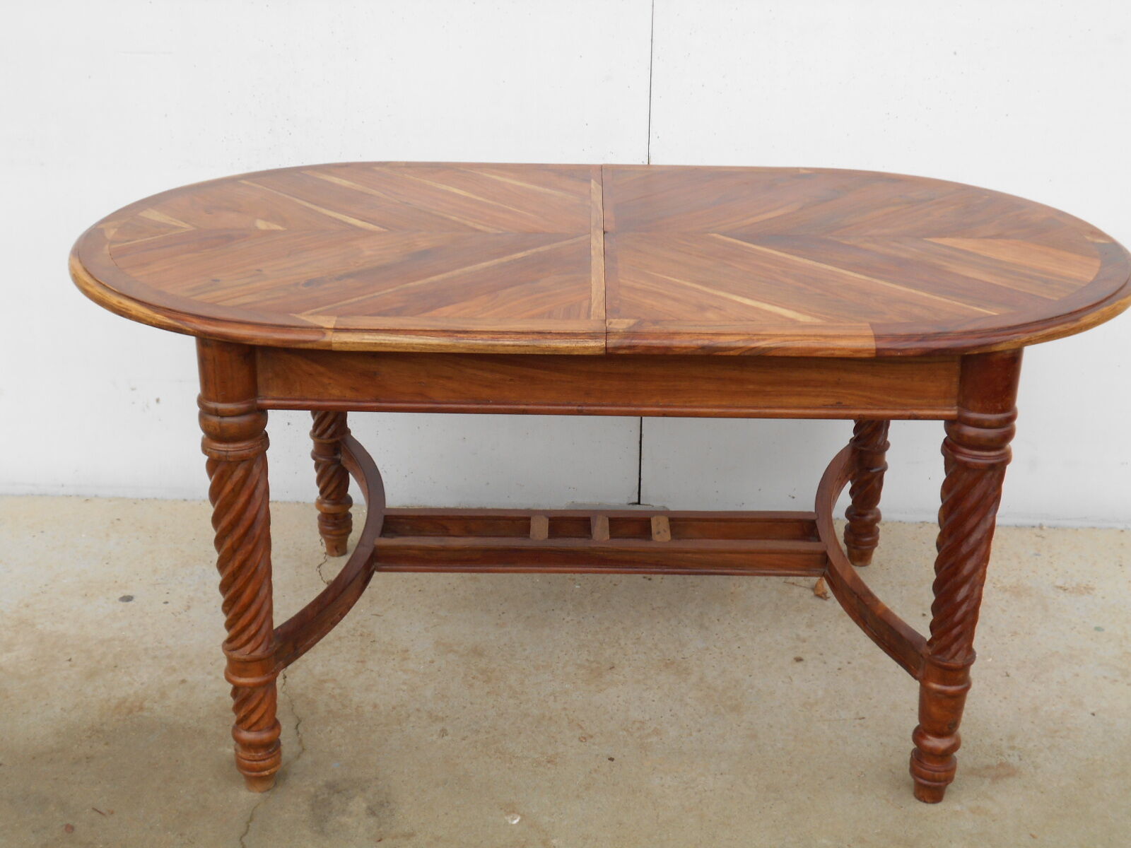 Oval table, integrated extension, in exotic wood