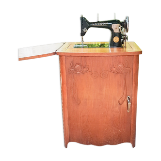 Cosson sewing machine built into a 1940 wooden cabinet