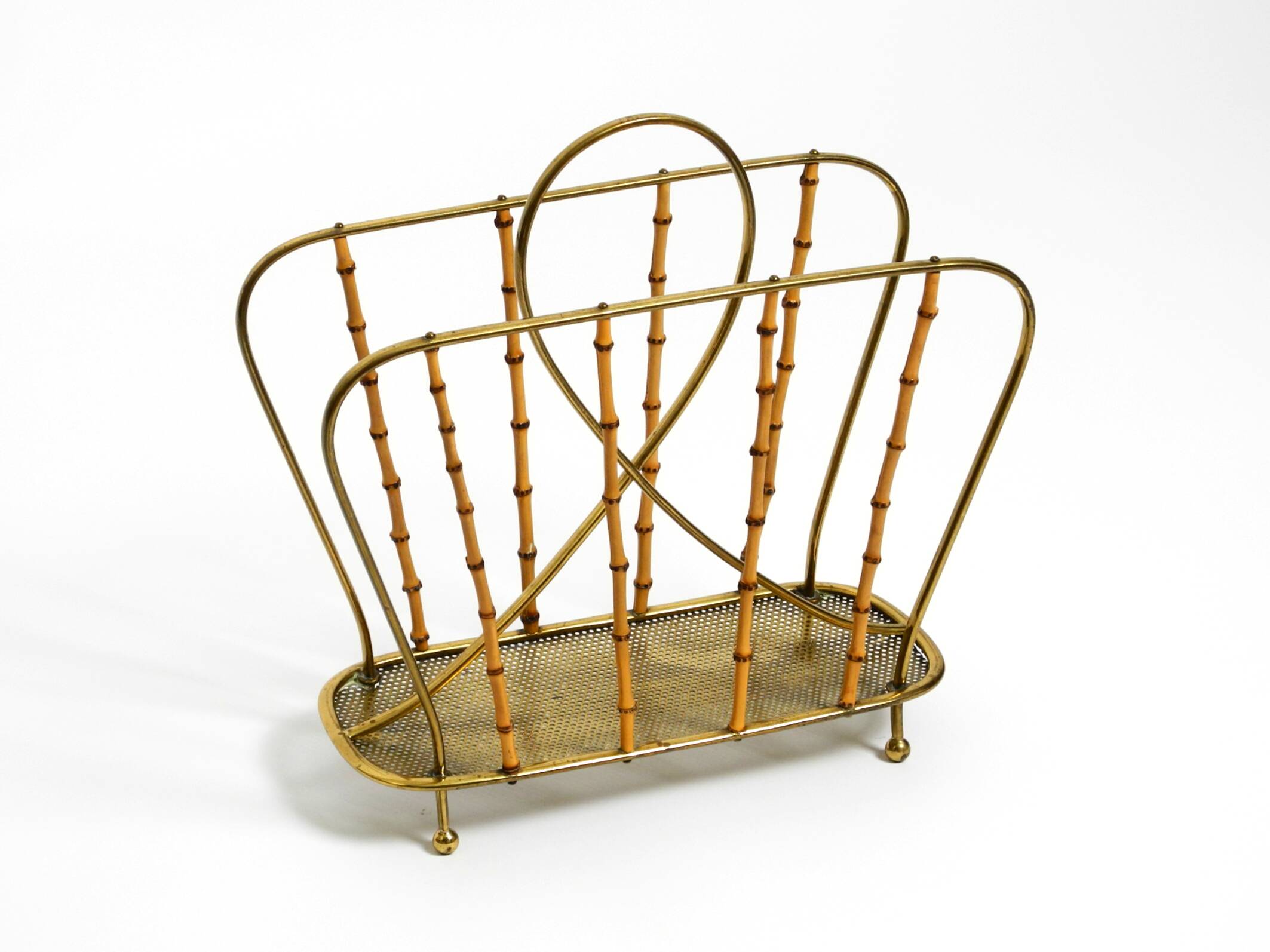 Rare Mid Century Modern magazine rack made of solid brass and genuine bambo