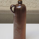 Old enamelled brown sandstone bottle with cork stopper