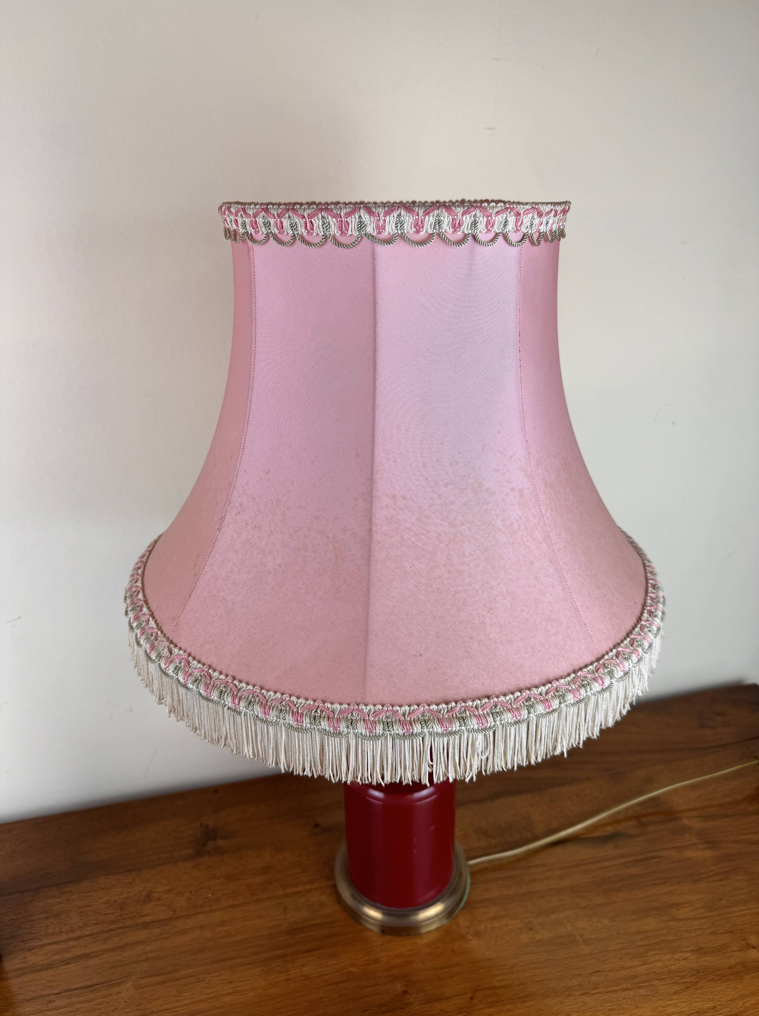 Art deco style desk lamp with a burgundy red sphere in the center the body is in lacquered iron