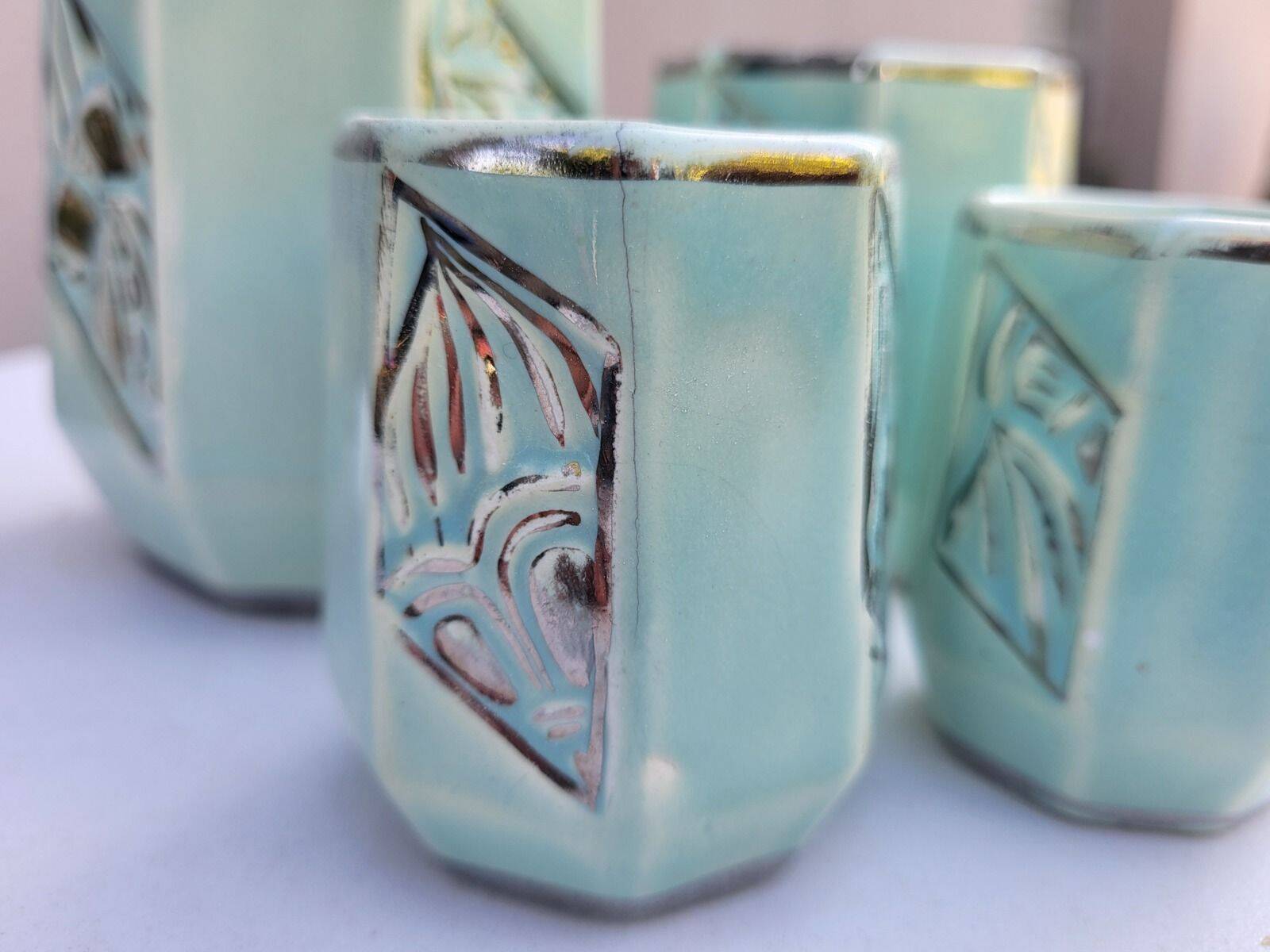 Set of 4 Art Deco celadon green and silver barbotine pots.
