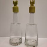 pair of decanters, bottles or jars, made in crystal with a ceramic tap enameled in green color