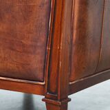 Comfortable Art Deco design armchair in cognac-colored sheepskin combined with wood