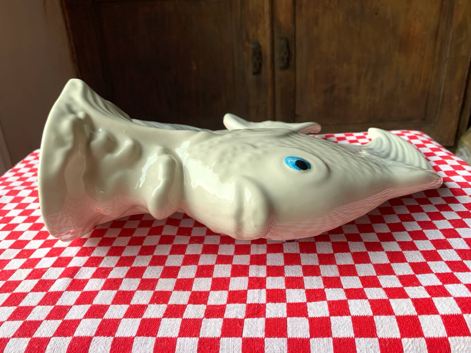 Large white ceramic fish to place.