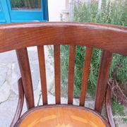 4 bentwood bistro chairs with a pattern on the seat