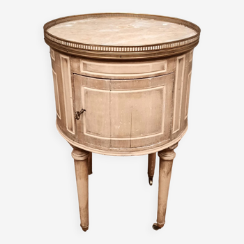 Round bedside table painted in trompe l'oeil