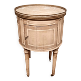 Round bedside table painted in trompe l'oeil