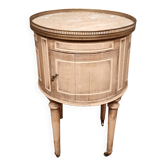 Round bedside table painted in trompe l'oeil