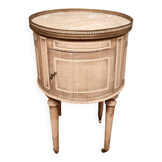 Round bedside table painted in trompe l'oeil