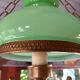 Old green opaline chandelier, gold metal and earthenware