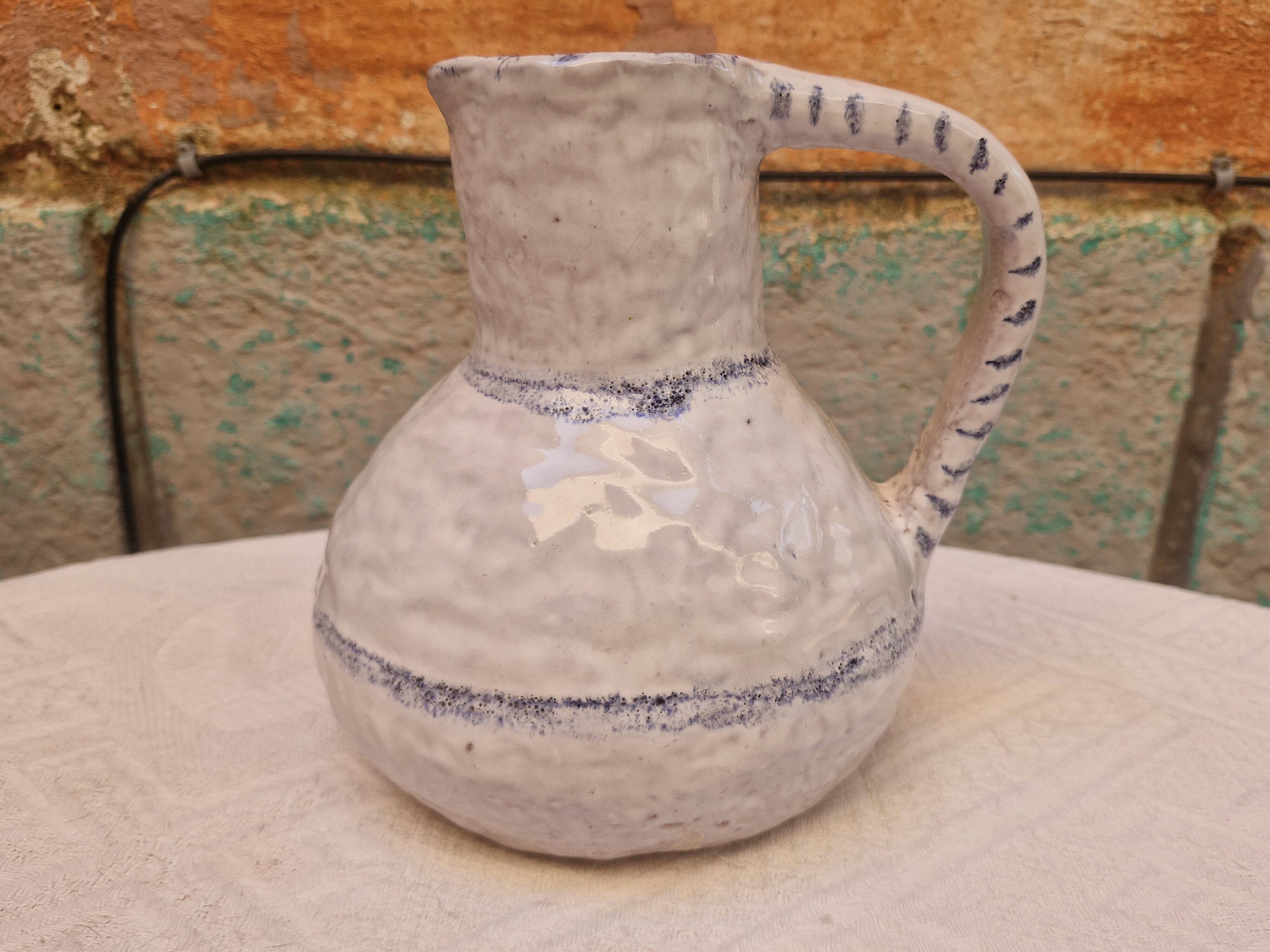 Old stamped glazed terracotta jug