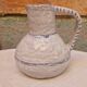 Old stamped glazed terracotta jug