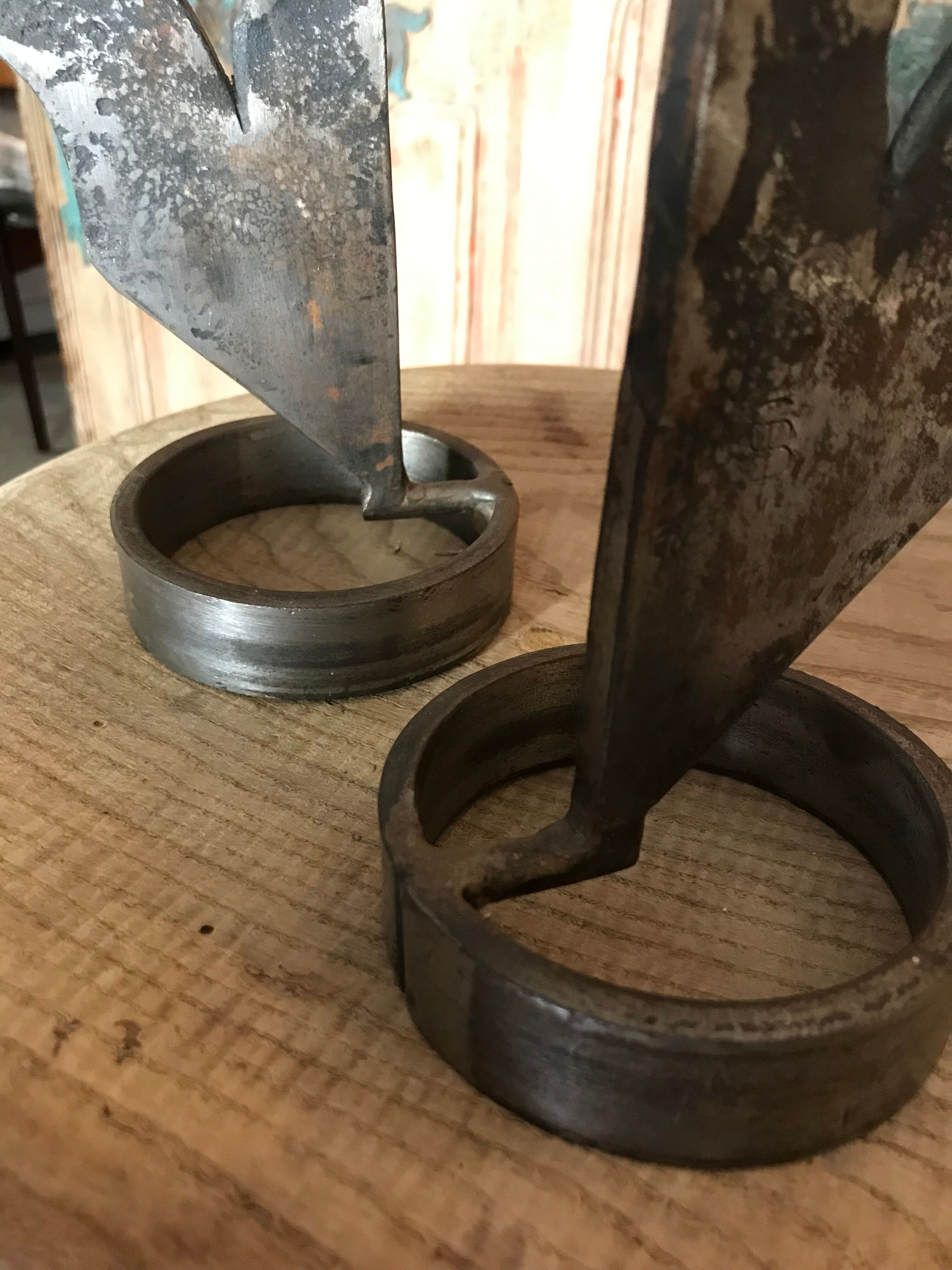 Signed zoomorphic iron candle holders