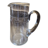 Antique glass water jug, engraved with Louis XVI garland decorations.