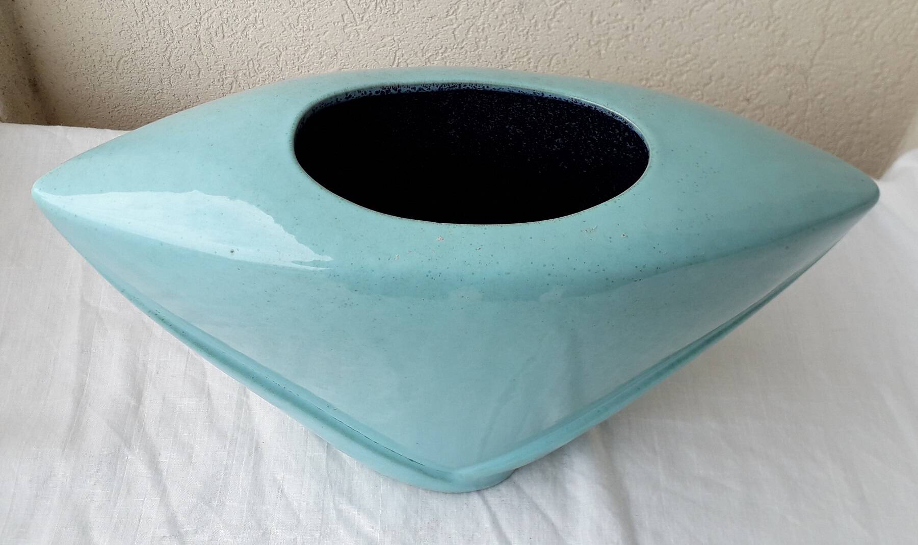 Triangular ceramic vase