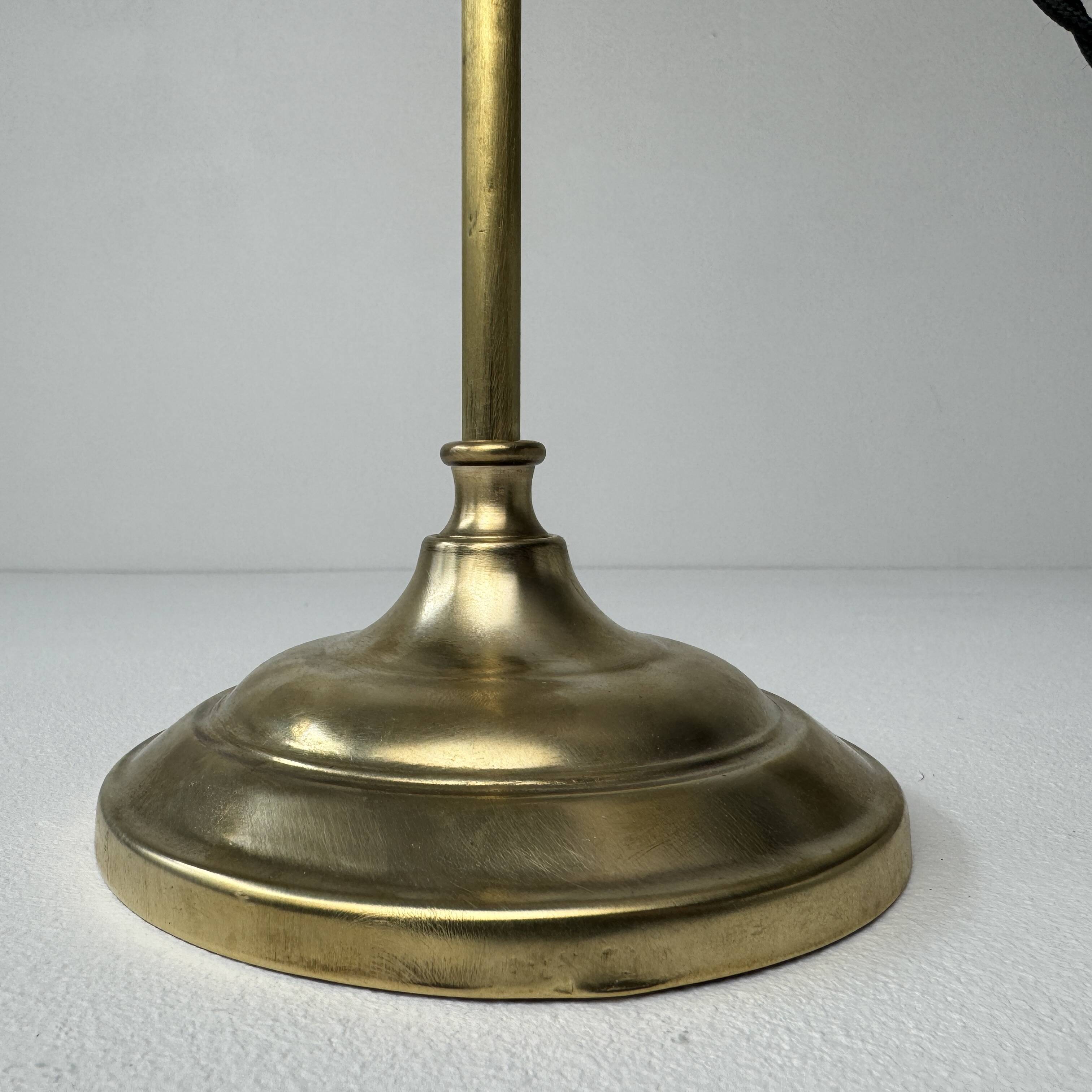 Vintage desk lamp that raises and lowers.