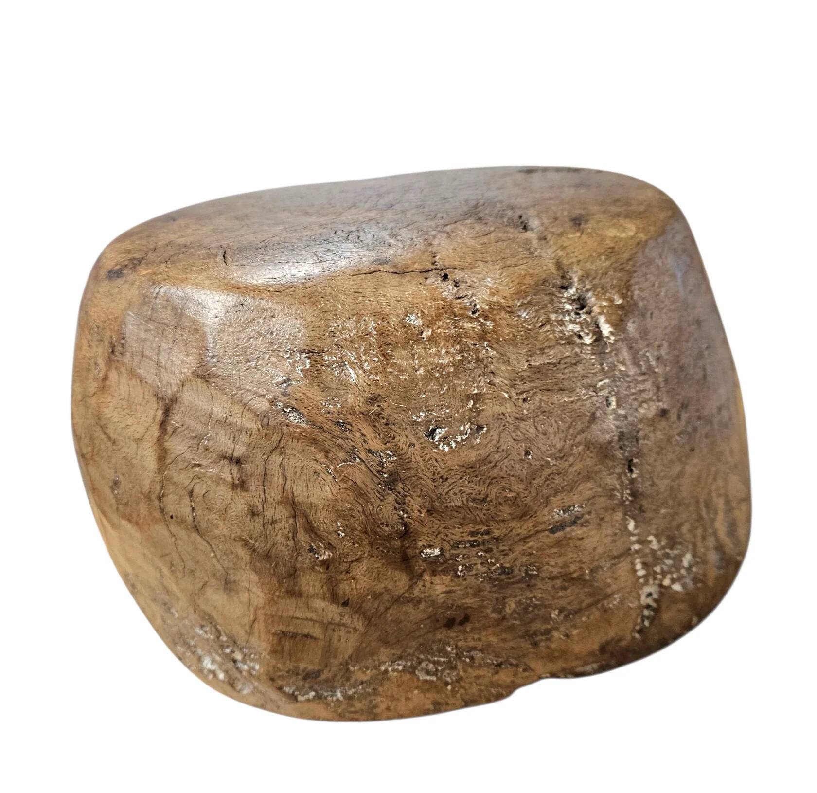 A substantial hand-hewn wooden bowl carved from a single burl section