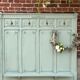 Cloakroom with sage green wall coats