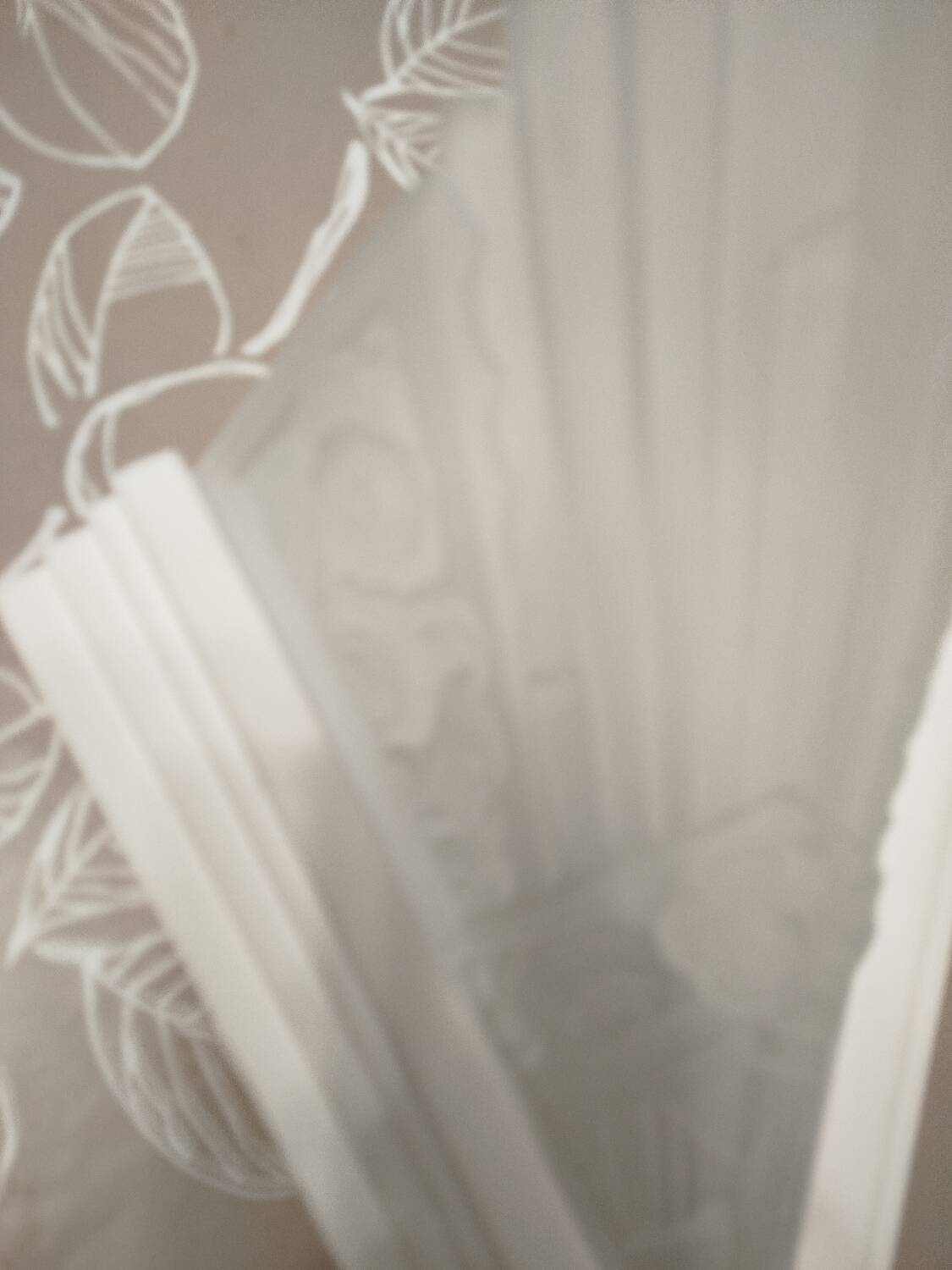 Pair of Art Deco wall sconces in plaster and pressed glass.