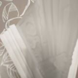 Pair of Art Deco wall sconces in plaster and pressed glass.