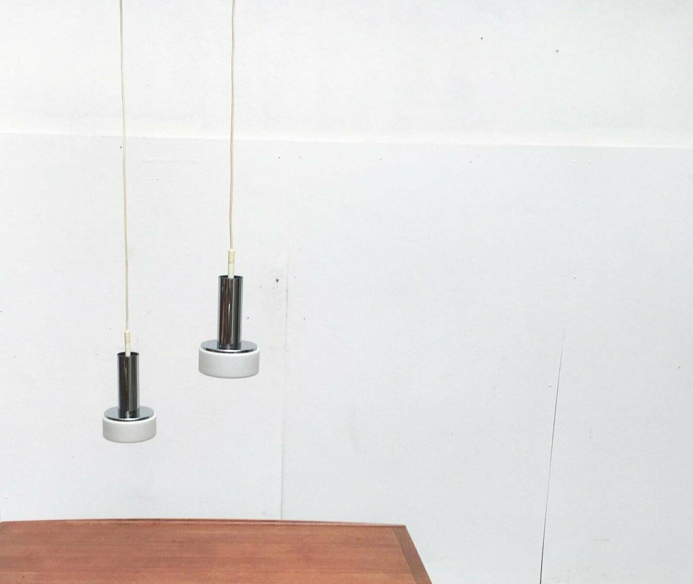 Suspended glass and chrome lamps model P105 German Mid-Century Space Age from the 1960s by Staff, set of 2.