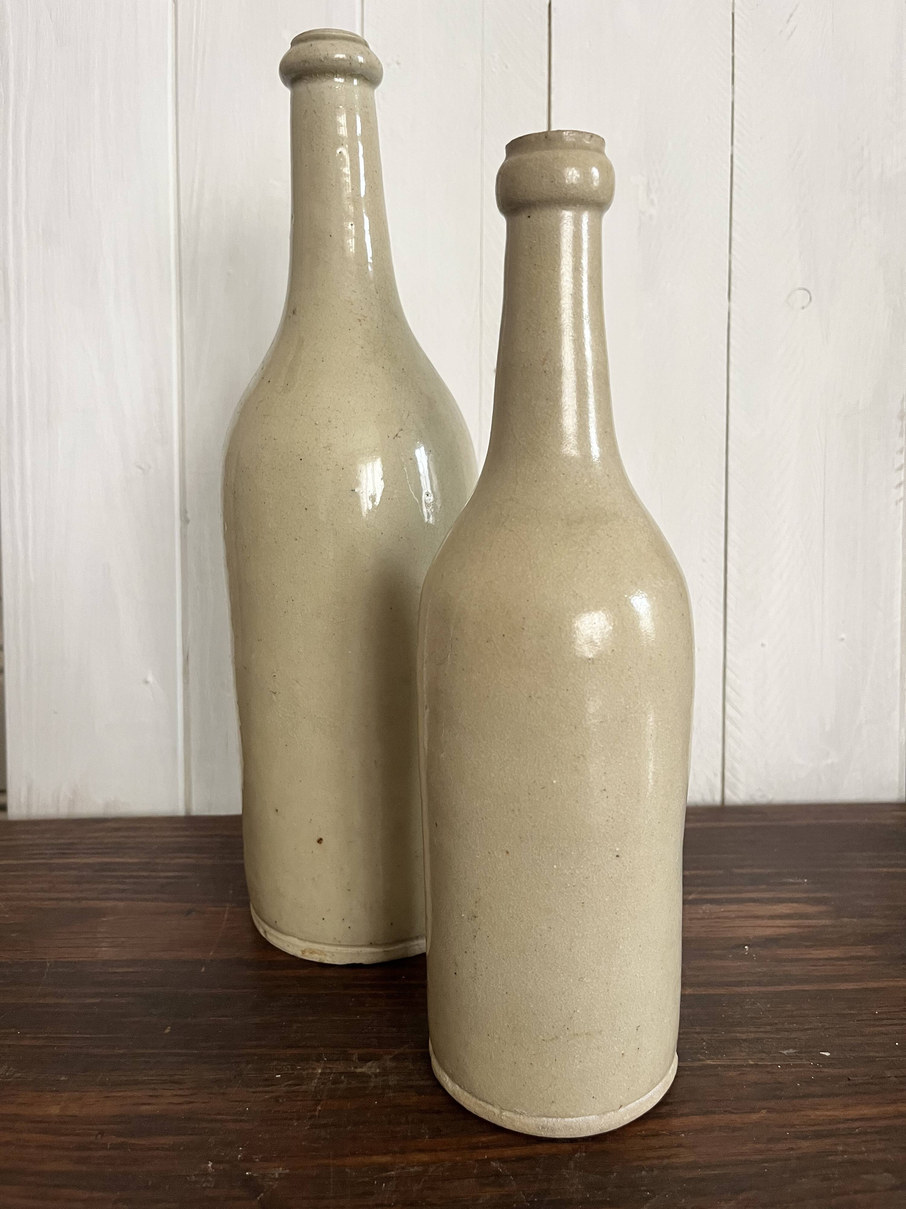 Pair of old glazed stoneware bottles