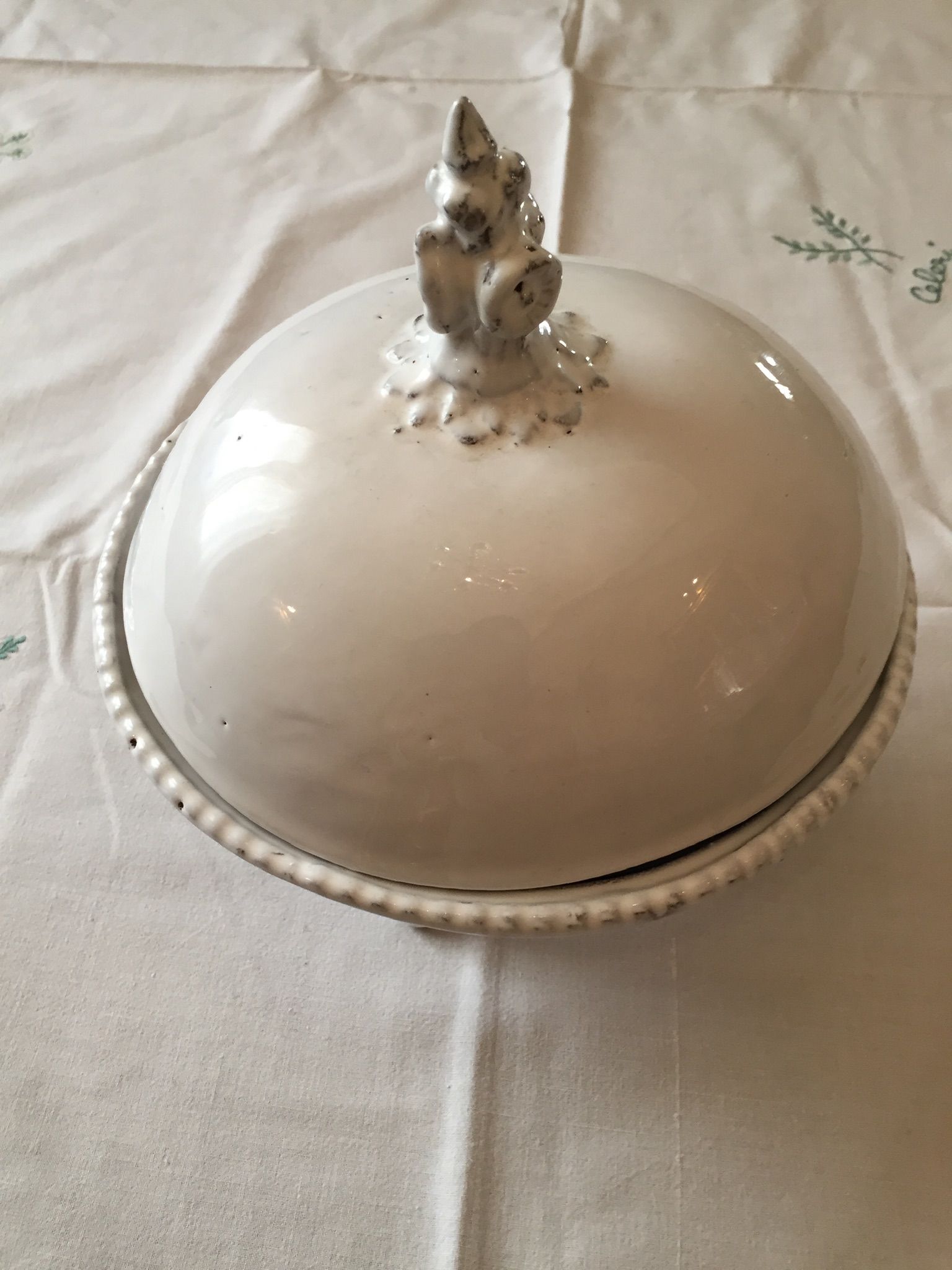 Covered cut of the House Astier de Villatte in black white enamelled earth