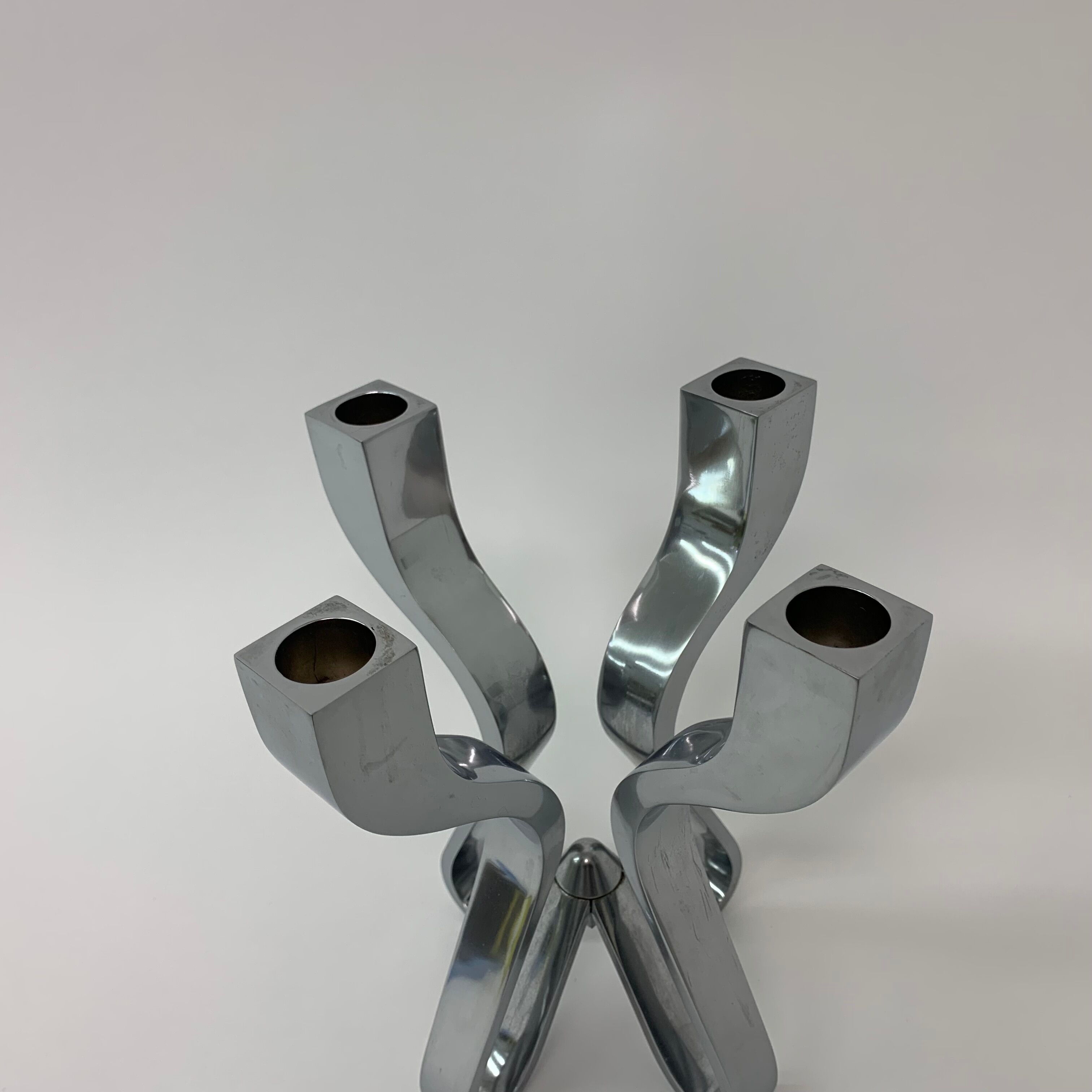 A chromed metal candle-holder "Chorus", design Karim Rashid, executed by Umbra / USA 2002