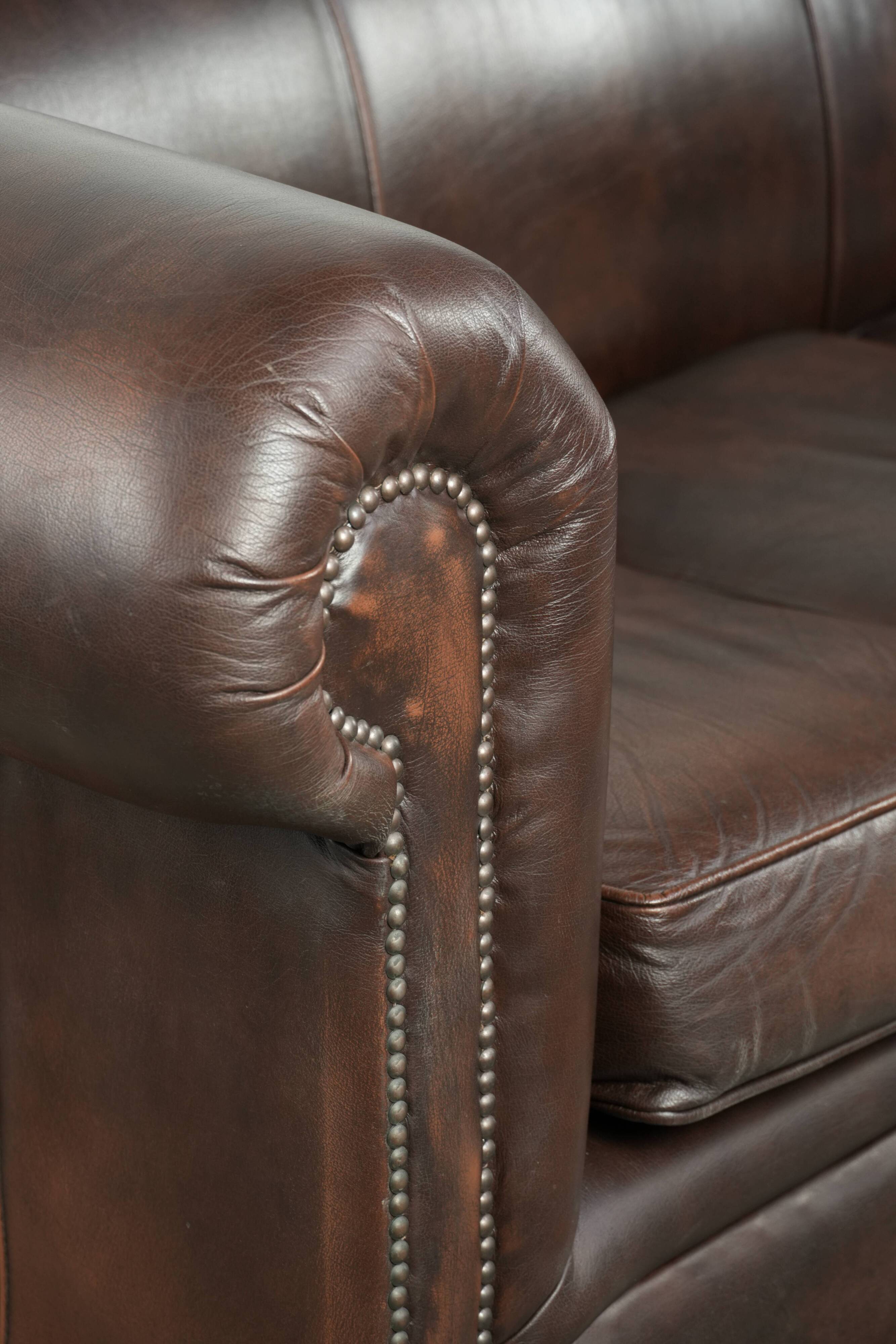 Luxury brown smooth cow leather Chesterfield sofa with an English look