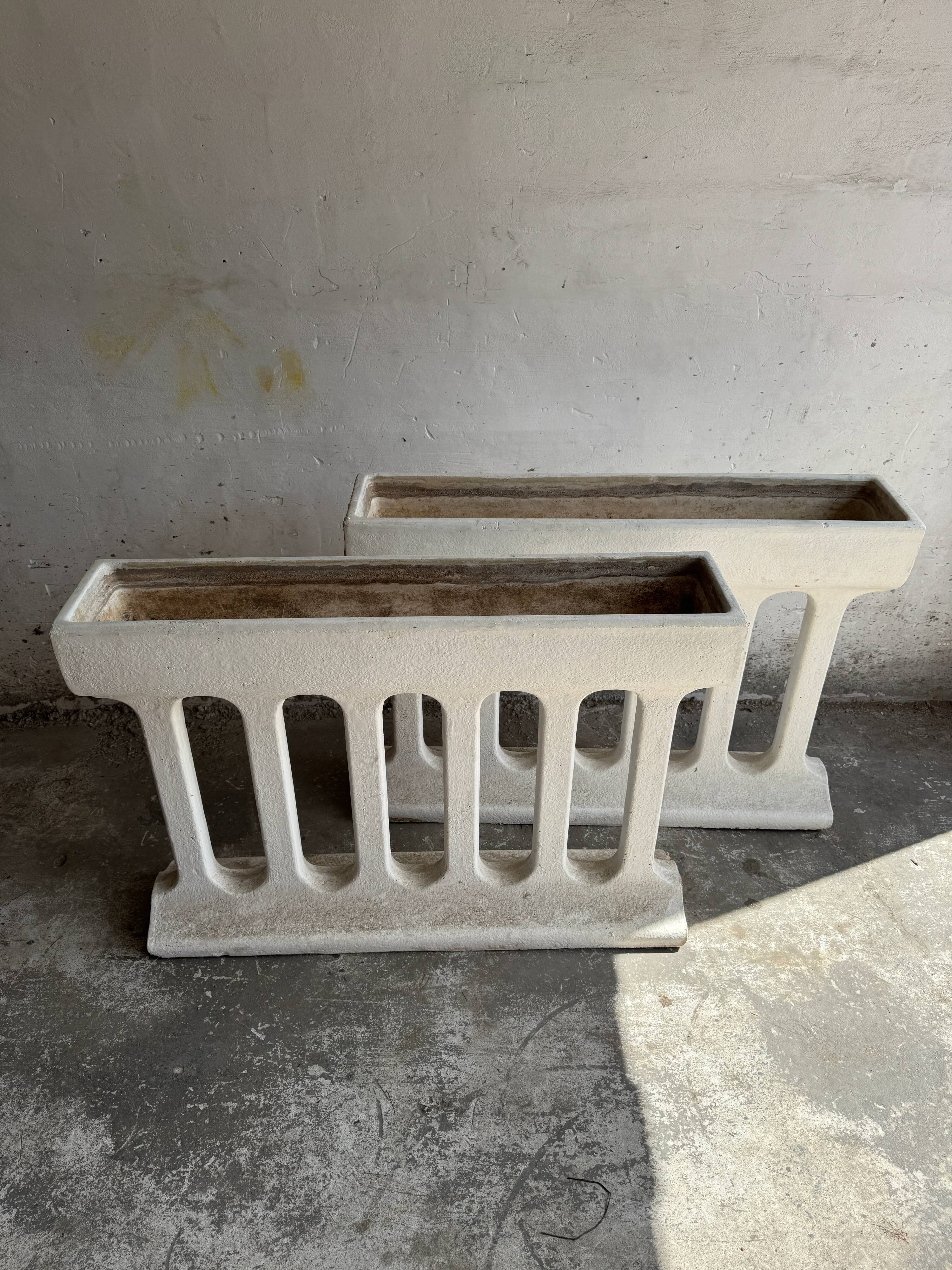 Pair of sculptural cast concrete planters in Off-White, mid-century brutalist style, long and rectangular.
