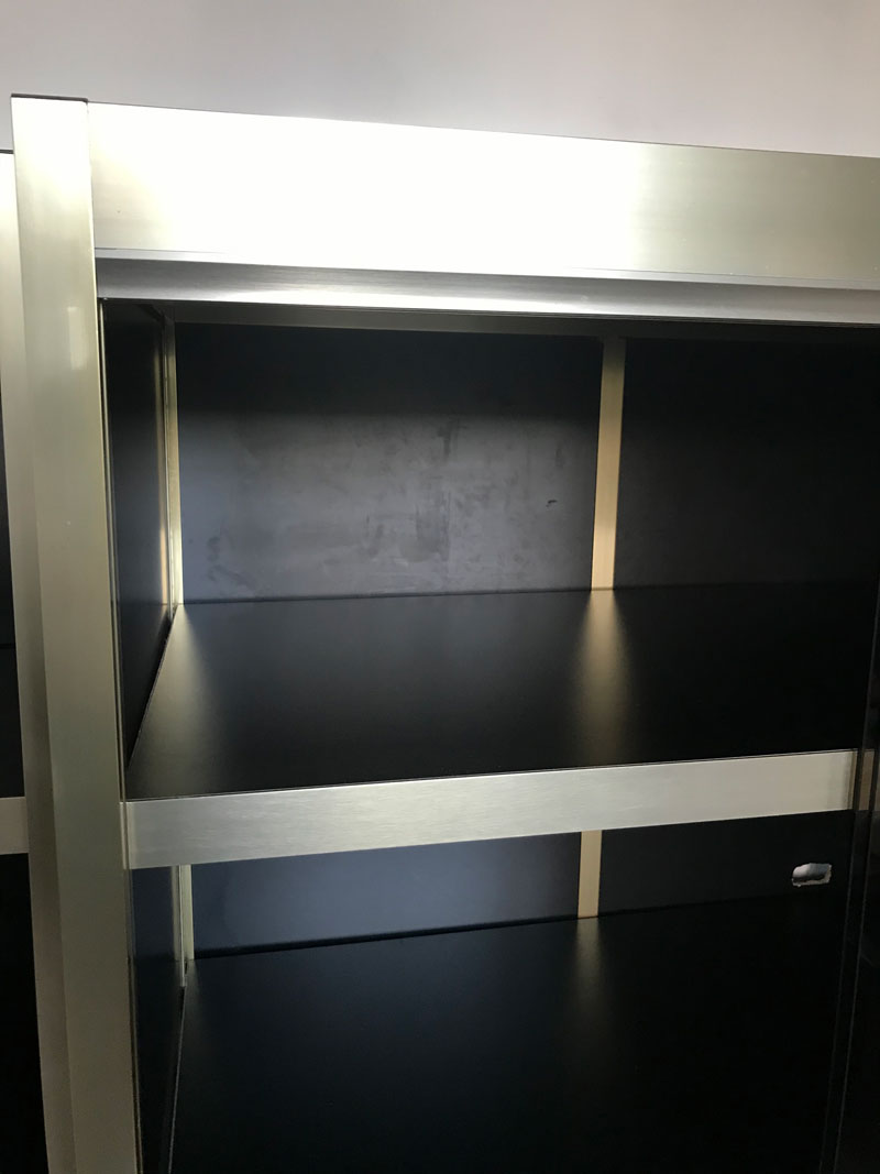 Shelves of black and gold windows