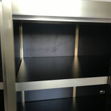 Shelves of black and gold windows