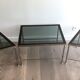 Rare three-part nickel coffee table with lacquered glass tops around the perimeter