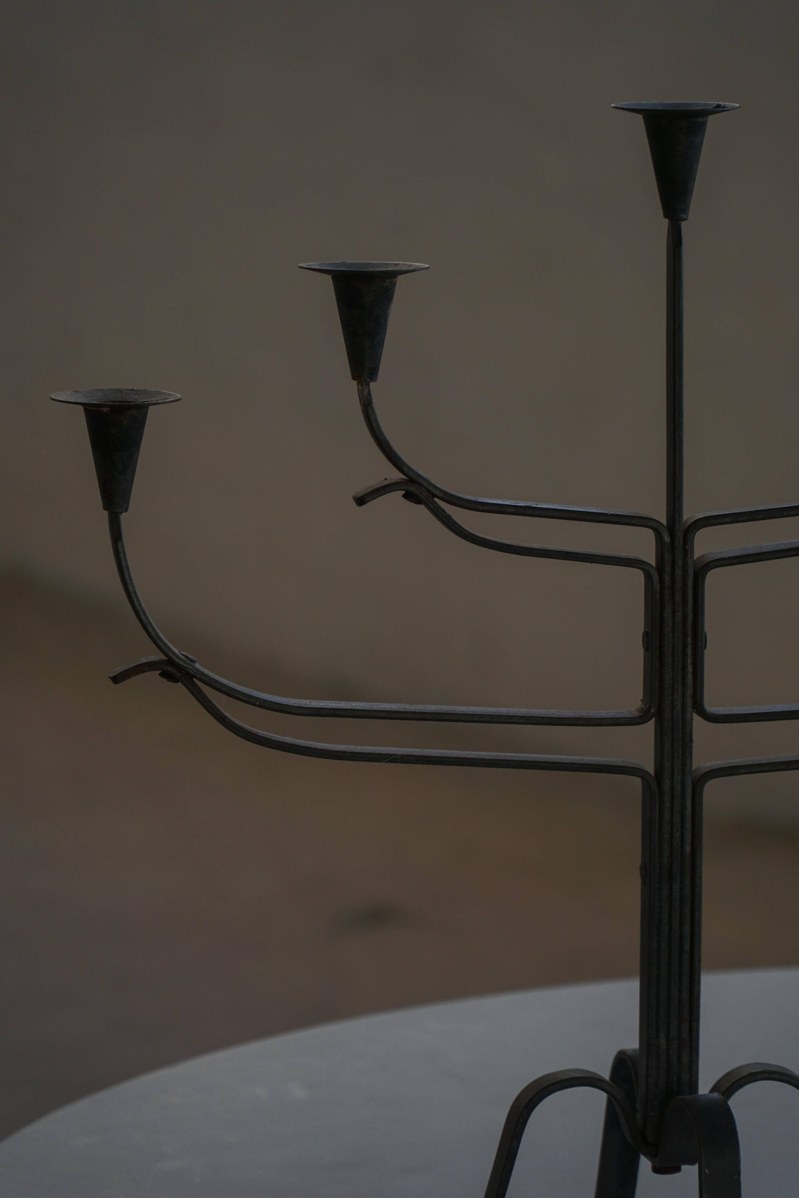 Brutalist Scandinavian candlestick in wrought iron and metal from the mid-20th century.