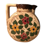 Ceramic pitcher with floral decoration signed Lucq