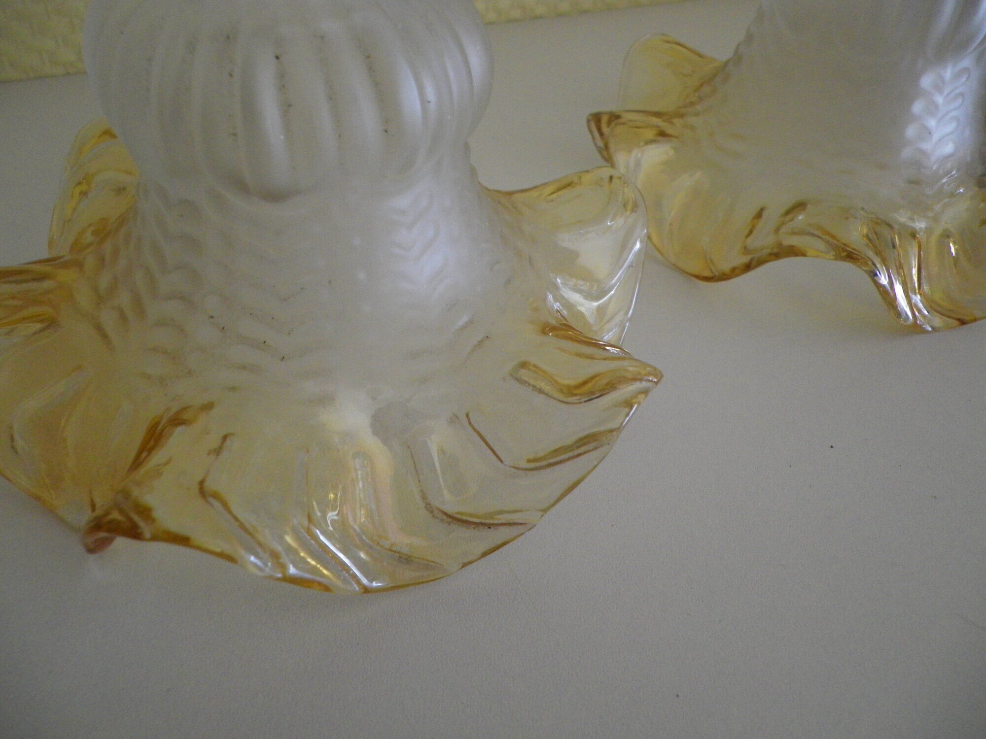Wall lamps, opaque corolla and iridescent ochre lampshade, brass and wood support