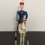 Soldier on wooden horse to shoot