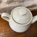 Small light beige earthenware teapot
